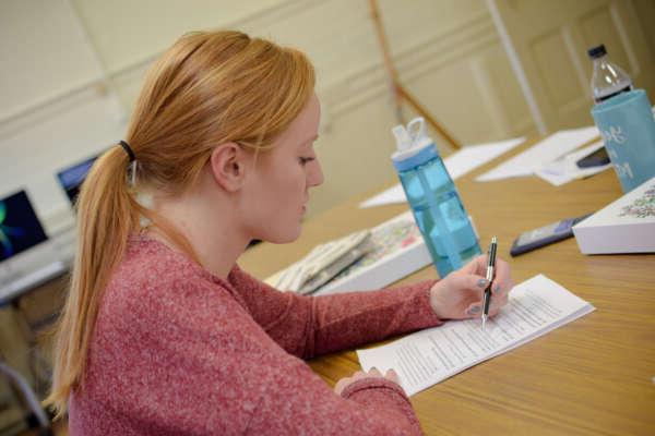 Student studying at a table